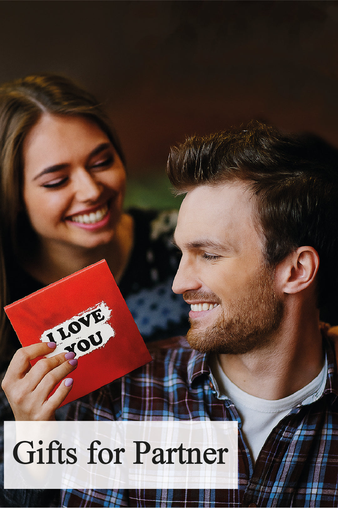 a couple together holding I love you gift