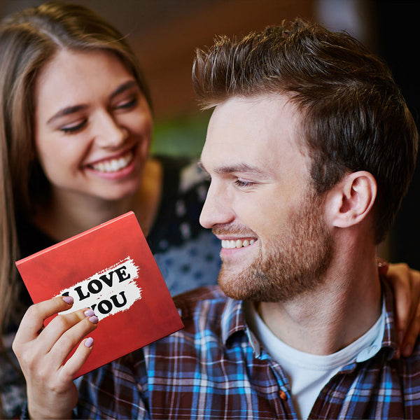 Happy couple with a gift